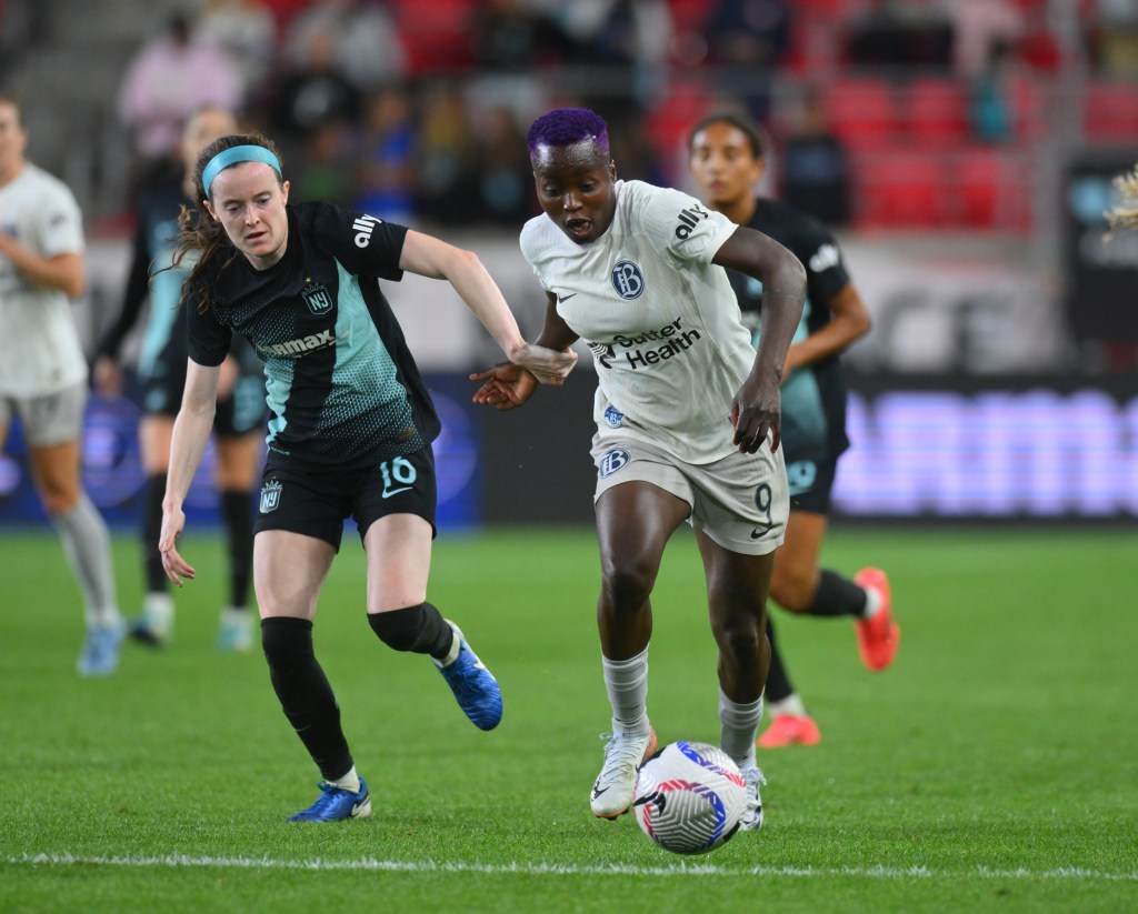 otham FC midfielder Rose Lavelle (16) battles Bay FC forward Racheal Kundananji (9) for control of ball