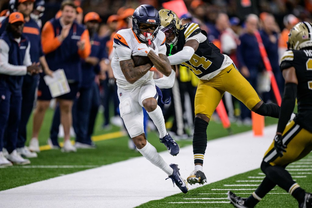 Broncos wide receiver Troy Franklin (16) stays inbounds for a reception against New Orleans Saints cornerback Kool-Aid McKinstry