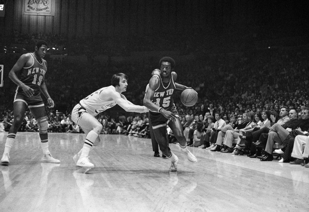 Earl Monroe dribbles around Gail Goodrich of the Lakers during Game 5 of the 1973 NBA Finals.