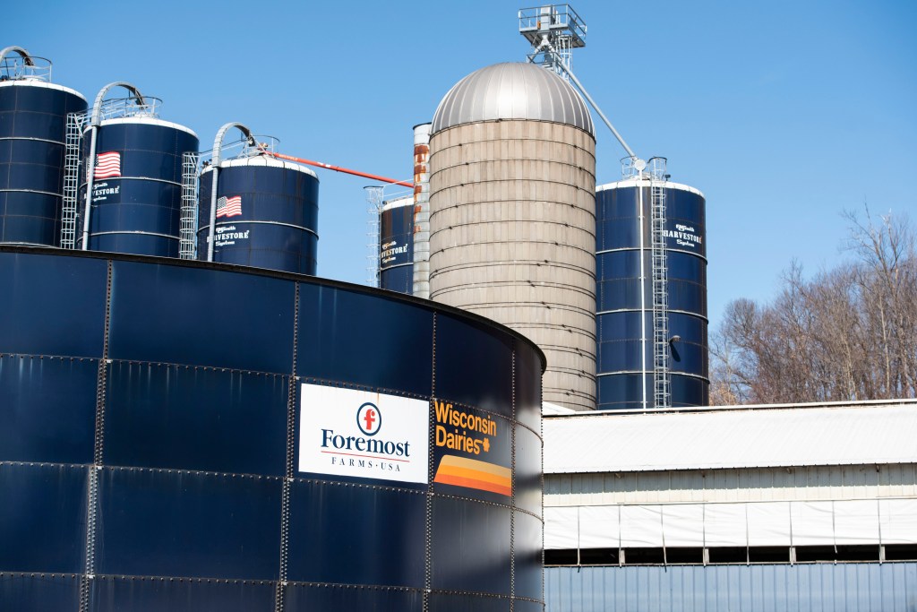 Dairy farm in Loganville, Wisconsin, symbolizing the tough economic downturn for American farmers, marked by glutted grain markets and trade wars