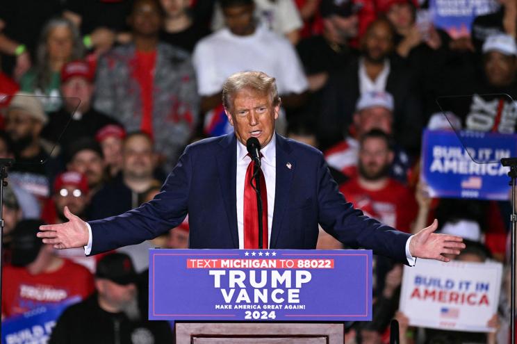 Former President and Republican presidential candidate Donald Trump speaks during a campaign rally at Huntington Place in Detroit, Michigan, October 18, 2024.