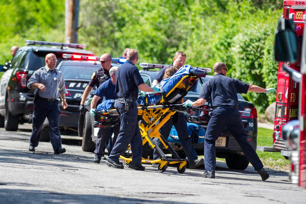 First responders take Payton Leutner, 12, to an ambulance following the stabbing on May 31, 2014 in Waukesha, Wis.