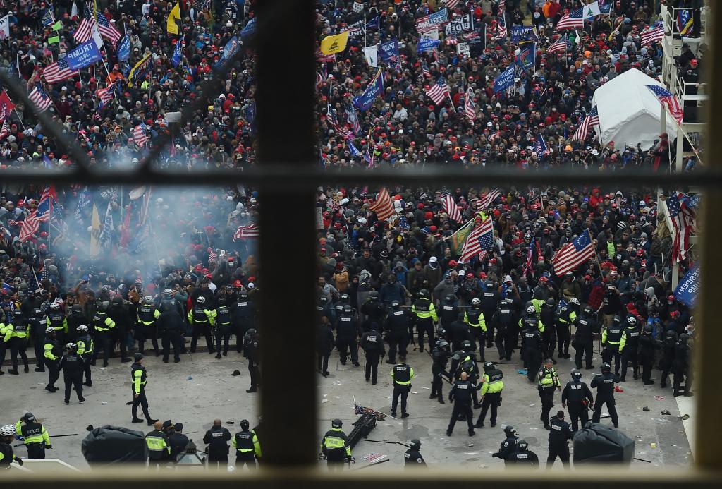 Police hold back supporters of US President Donald Trump as they gather outside the US Capitol's Rotunda on January 6, 2021, in Washington, DC.