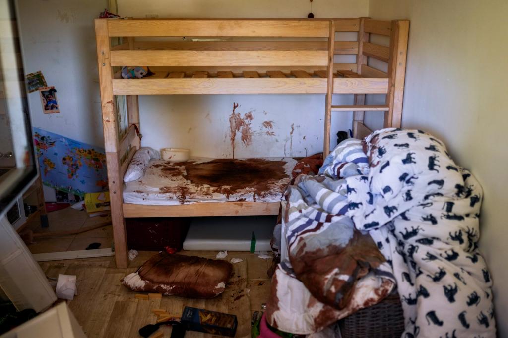 Blood is seen splattered in a child's room following a massive Hamas militant attack in Kibbutz Nir Oz, Israel, Thursday, Oct. 19, 2023. 