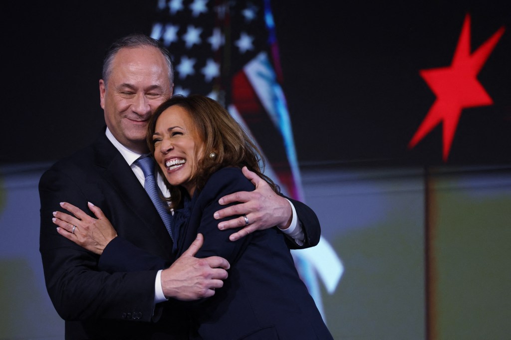 Kamala Harris embraces her husband Doug Emhoff.