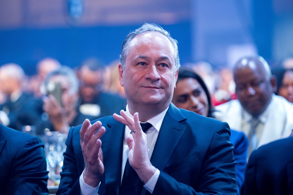 Second Gentleman Doug Emhoff claps as Democratic presidential nominee U.S. Vice President Kamala Harris speaks during the Congressional Black Caucus Foundationâs Phoenix Awards dinner at Walter E. Washington Convention Center in Washington, U.S., September 14, 2024. 