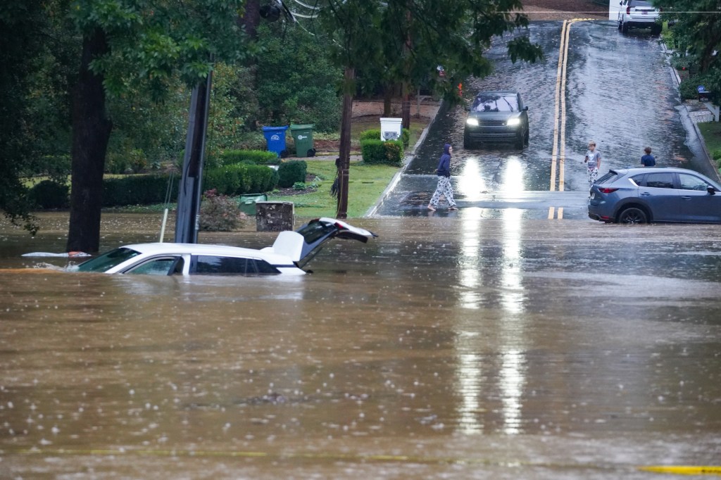 Streets are flooded near Peachtree Creek after Hurricane Helene brought in heavy rains over night on September 27, 2024 in Atlanta, Georgia. 