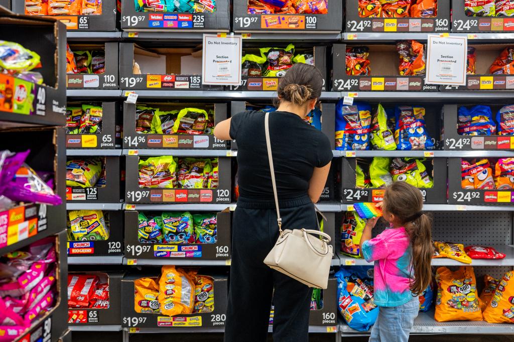 A family shopping for Halloween candy at a Walmart Supercenter in Austin, Texas, October 16, 2024, amidst a cocoa shortage leading to higher prices