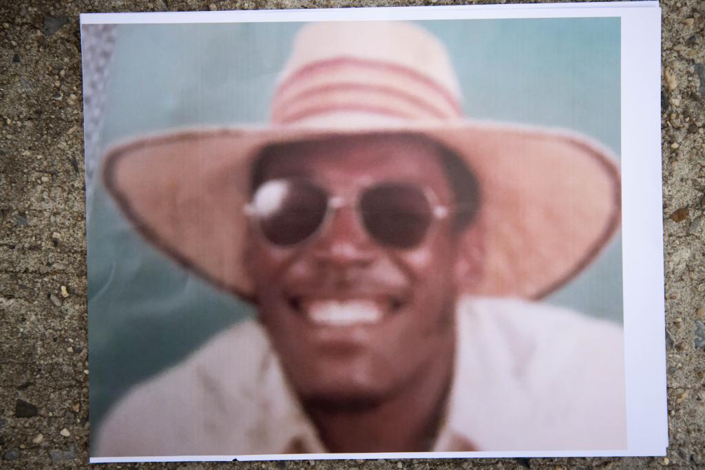 Transit Officer Robert Venable wears a large straw hat. 