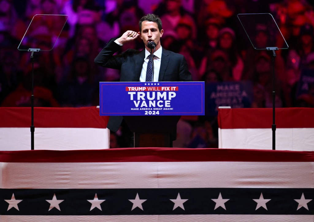 US comedian Tony Hinchcliffe speaking at a podium during a campaign rally for Donald Trump at Madison Square Garden, New York.