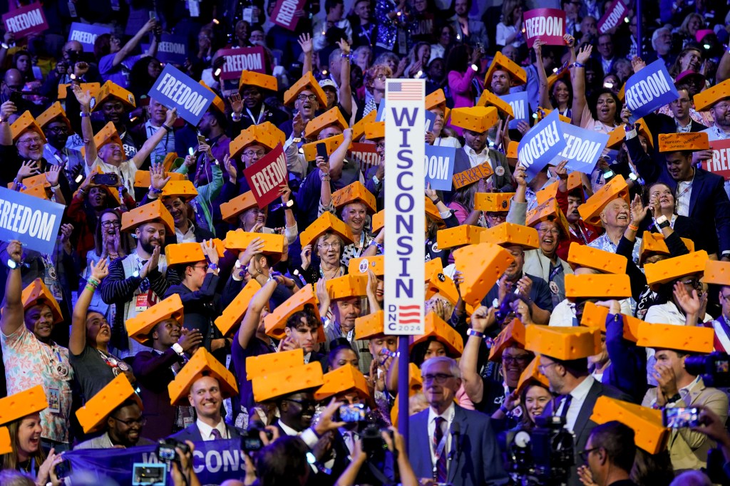 Wisconsin delegates wearing cheese hats during a ceremonial roll call vote at the 2024 Democratic National Convention in Chicago, Illinois.