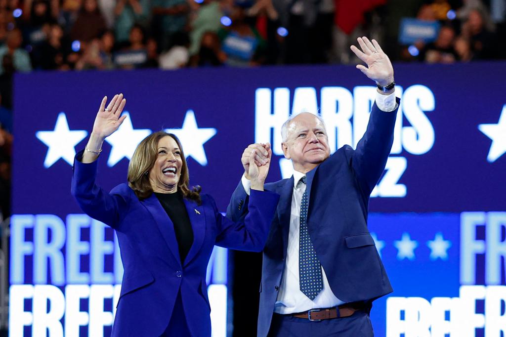 Kamala Harris and Tim Walz on stage together.