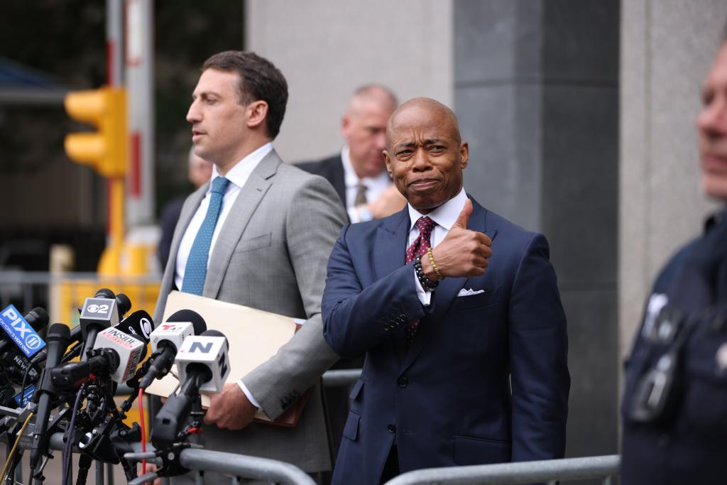 Attorney Alex Spiro and Mayor Eric Adams hold a news conference outside a federal courthouse.