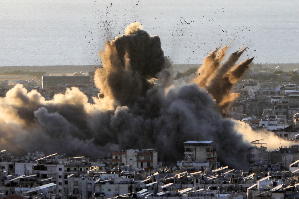 A large smoke cloud erupts from an Israeli airstrike in Beirut, Lebanon on Oct. 19, 2024.