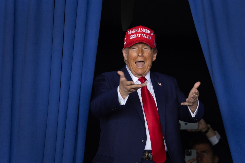 Republican presidential nominee, former President Donald Trump, arrives for a rally at Dodge County Airport on October 06, 2024 in Juneau, Wisconsin.