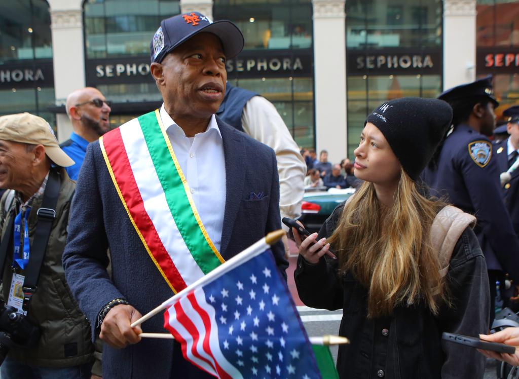 New York Mayor Eric Adams wears an old subway series baseball cap while marching in the annual Columbus Day Parade Monday, Oct. 14, 2024.