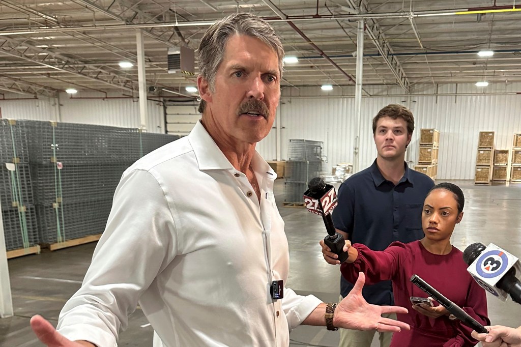 Republican Senate candidate Eric Hovde in a white shirt, calling for a reduction in attack ads on Sept. 5, 2024 in Waunakee, Wisconsin