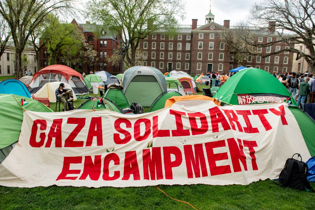 Pro-Palestinian students are seen above in a tent encampment on the grounds of Brown University in Providence, RI on April 29.