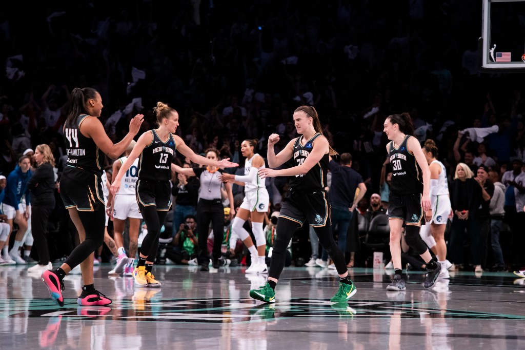 Sabrina Ionescu #20 and Betnijah Laney-Hamilton #44 of the New York Liberty  reacts during Game 2 of the 2024 WNBA Finals against the Minnesota Lynx at Barclays Center . 