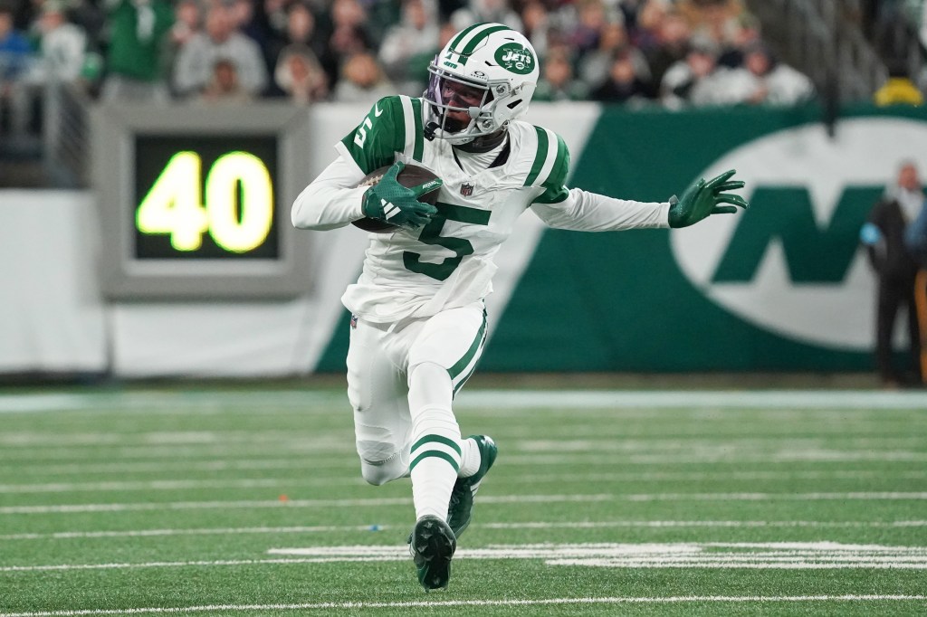 New York Jets wide receiver Garrett Wilson (5) carries a ball during the first half against the Buffalo Bills at MetLife Stadium.