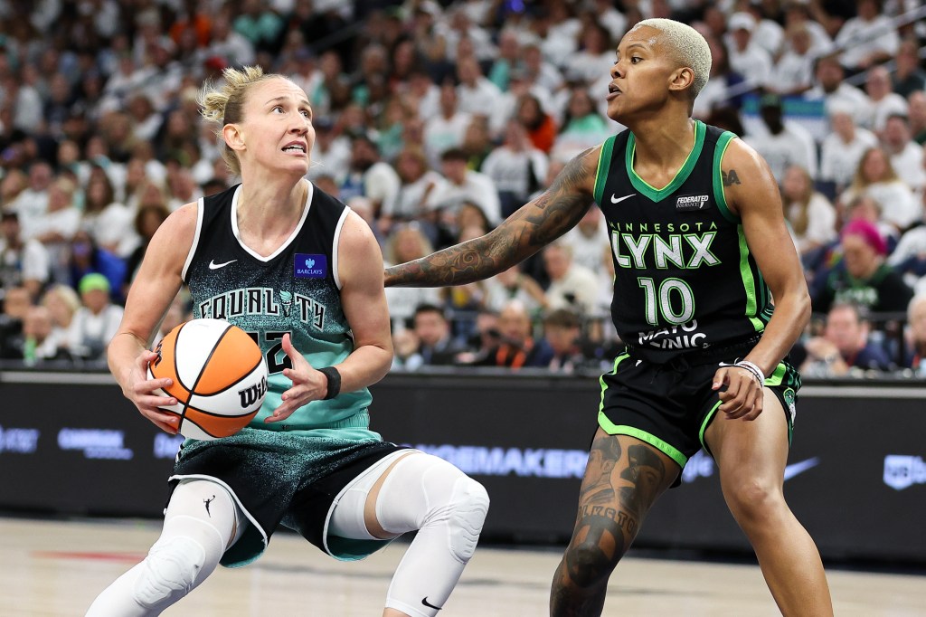 New York Liberty guard Courtney Vandersloot (22) works around Minnesota Lynx guard Courtney Williams (10) during the second half of game four of the 2024 WNBA Finals at Target Center. 