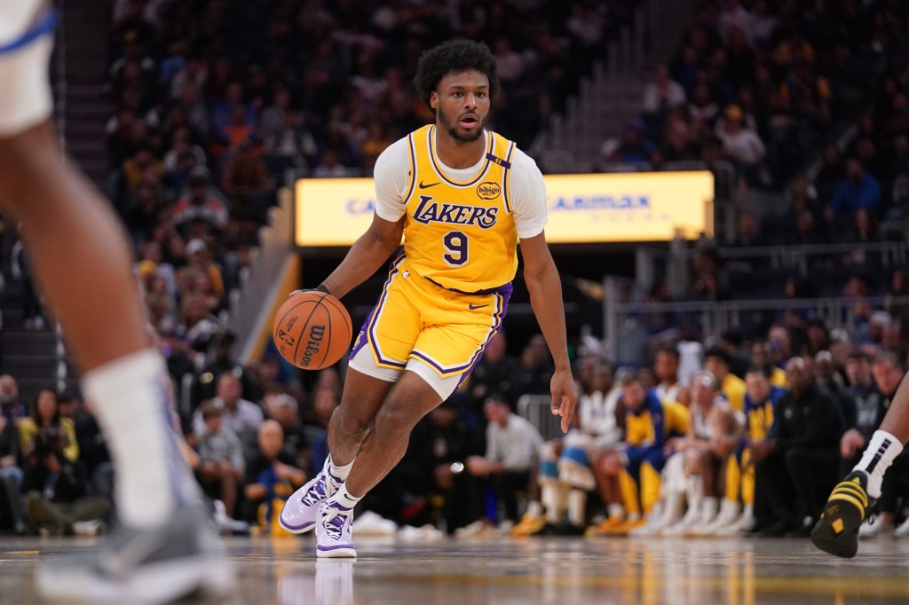 Los Angeles Lakers guard Bronny James (9) dribbles the ball against the Golden State Warriors in the second quarter at the Chase Center.