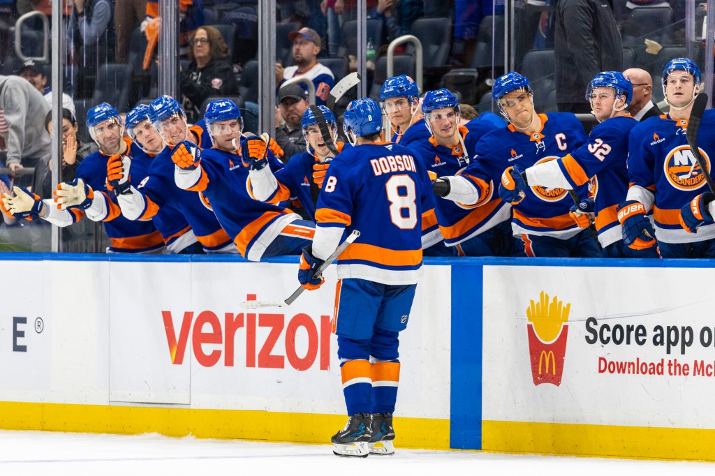 New York Islanders defenseman Noah Dobson (8) scores in the shootout.