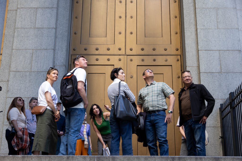 K. Krombie, tour guide at Purefinder and author of Death in New York: History and Culture of Burials, Undertakers and Executions, leads her Death in New York tour stopping at City Hall Park on October 20, 2024 in New York City.