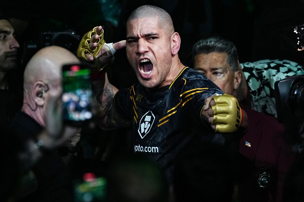 Alex Pereira pantomimes firing an arrow during his June walkout at UFC 303.