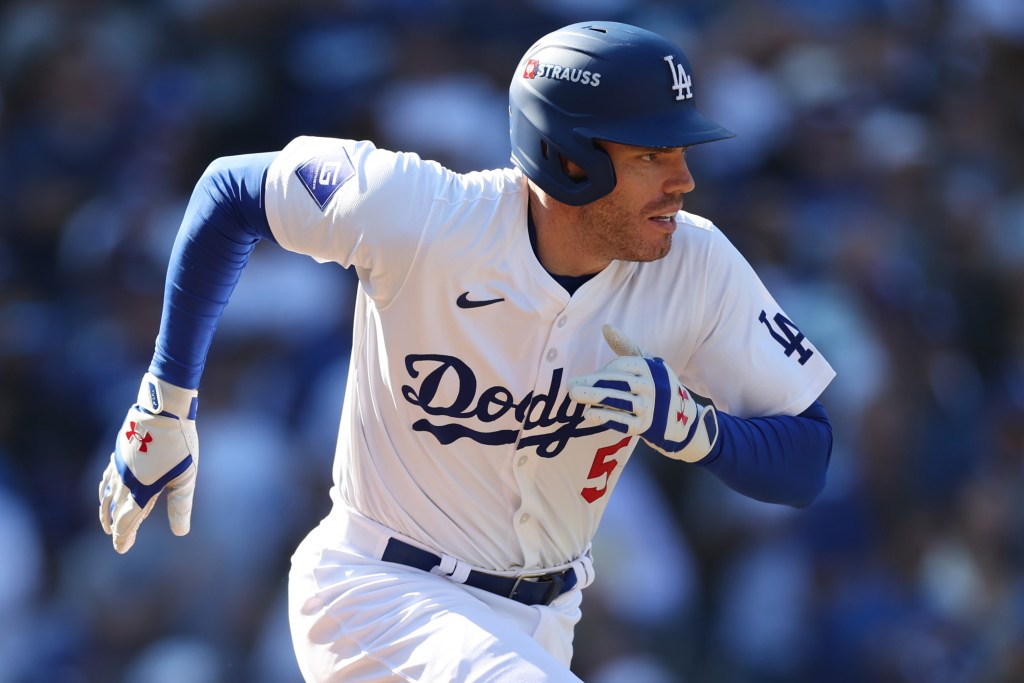 Freddie Freeman #5 of the Los Angeles Dodgers hits a single to load the bases against the New York Mets in the sixth inning during Game Two of the Championship Series at Dodger Stadium on October 14, 2024 in Los Angeles, California.