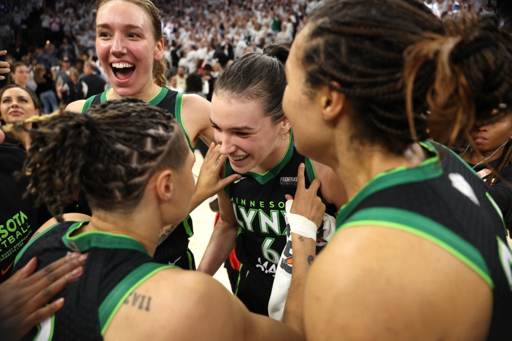 Bridget Carleton #6 of the Minnesota Lynx celebrates with teammates after defeating the New York Liberty 82-80 in Game Four of the WNBA Finals at Target Center on October 18, 2024 in Minneapolis, Minnesota.