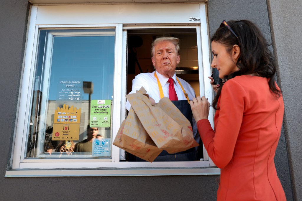 Former President Donald Trump working the drive-through line during a visit to a McDonald's restaurant in Feasterville-Trevose, Pennsylvania