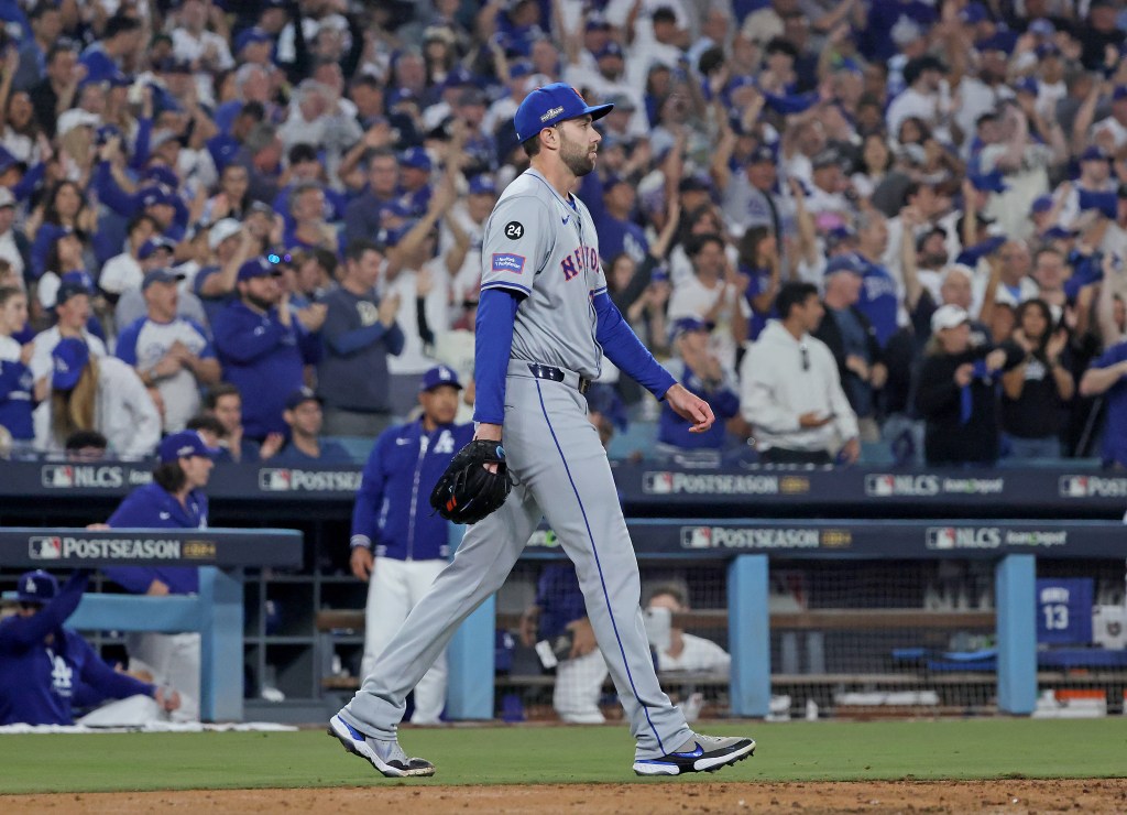 David Peterson #23 of the New York Mets reacts after Enrique Hernández #8 of the Los Angeles Dodgers scores on an RBI single by Tommy Edman #25 of the Los Angeles Dodgers during the fourth inning.