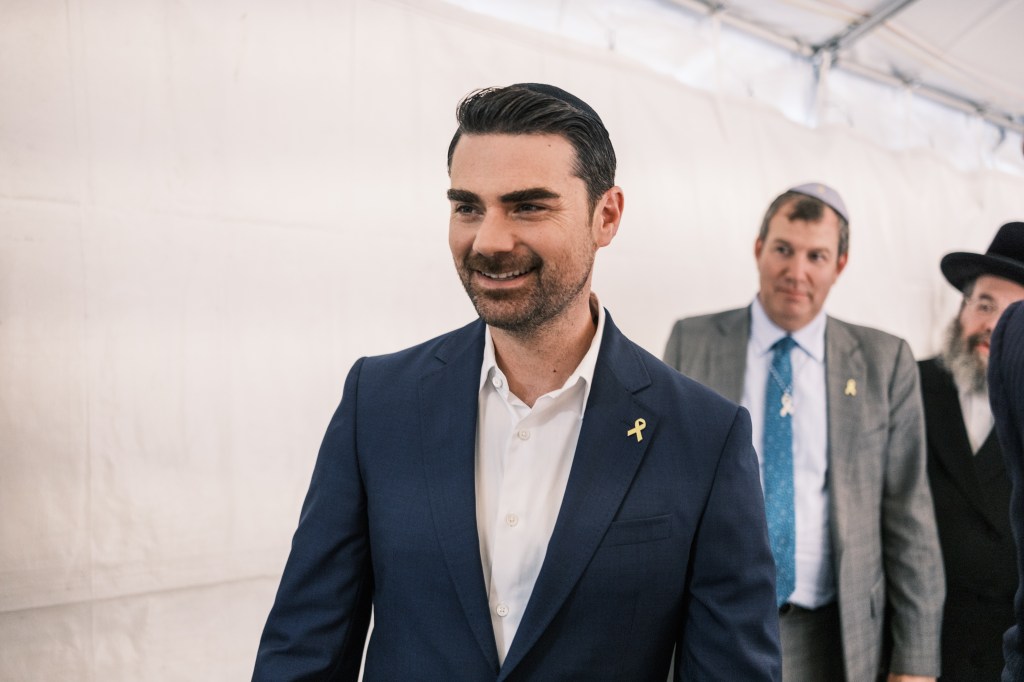 Former US president Donald Trump smiling while visiting the resting place of Rabbi Menachem M Schneerson with Ben Shapiro in New York City on October 7, 2024