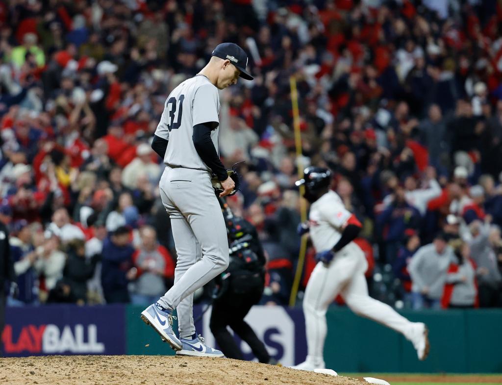 Luke Weaver of the New York Yankees reacting on the mound as Jhonkensy Noel of the Cleveland Guardians rounds the bases after a two-run home run during an ALCS game