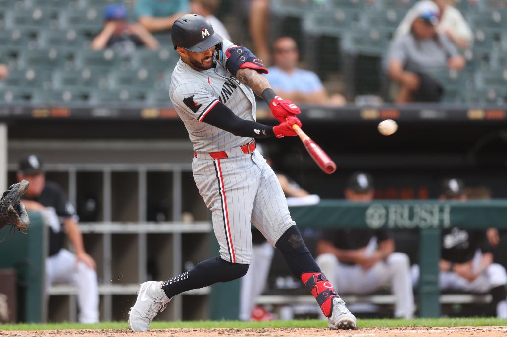 Carlos Correa #4 of the Minnesota Twins hits a solo home run off Drew Thorpe #33 of the Chicago White Sox (not pictured) during the sixth inning at Guaranteed Rate Field on July 10, 2024 in Chicago, Illinois. 