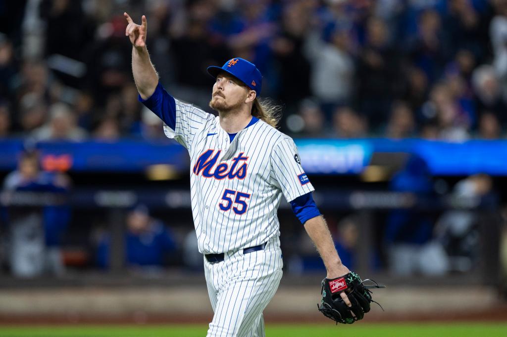 Ryne Stanek of the New York Mets walking back to the dugout, reacting after striking out Shohei Ohtani of the Los Angeles Dodgers in a game