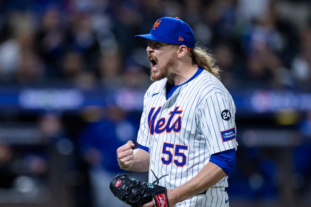 Ryne Stanek #55 of the New York Mets celebrating after ending the 7th inning in Game 5 of NLCS at Citi Field on Oct. 18, 2024