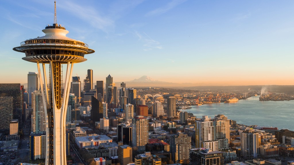 Seattle Skyline at sunset featuring the Space Needle and Korey Toomer