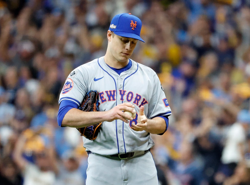 Phil Maton #88 of the New York Mets reacts after Jackson Chourio #11 of the Milwaukee Brewers scores on his solo homer to tie the game during the 8th inning. 