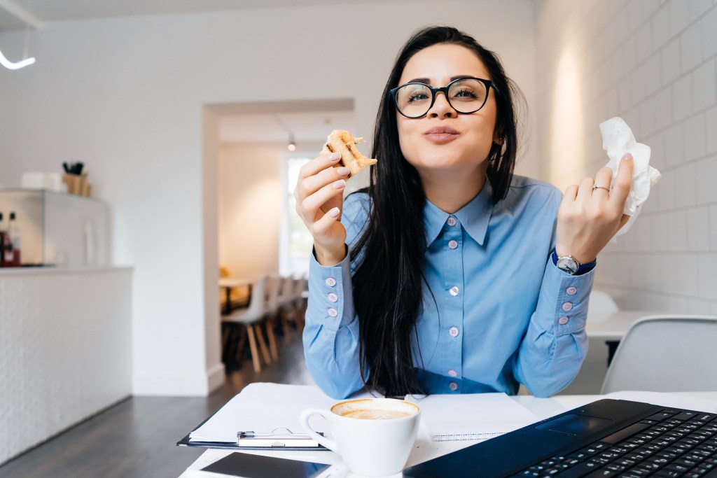 A happy worker eating lunch. 