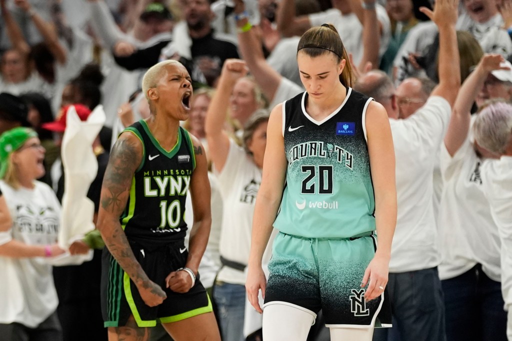 New York Liberty guard Sabrina Ionescu (20) reacts after missing a shot at the buzzer, as Minnesota Lynx guard Courtney Williams (10) celebrates during the second half of Game 4 of a WNBA basketball final playoff series, Friday, Oct. 18, 2024, in Minneapolis.