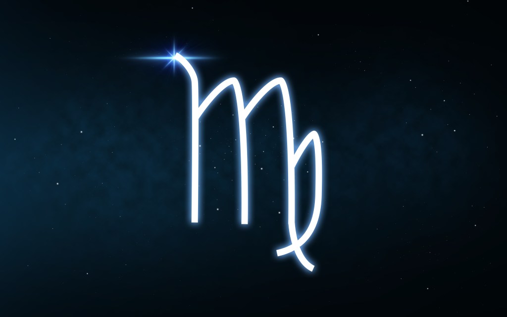 Virgo zodiac sign displayed over a dark night sky full of stars