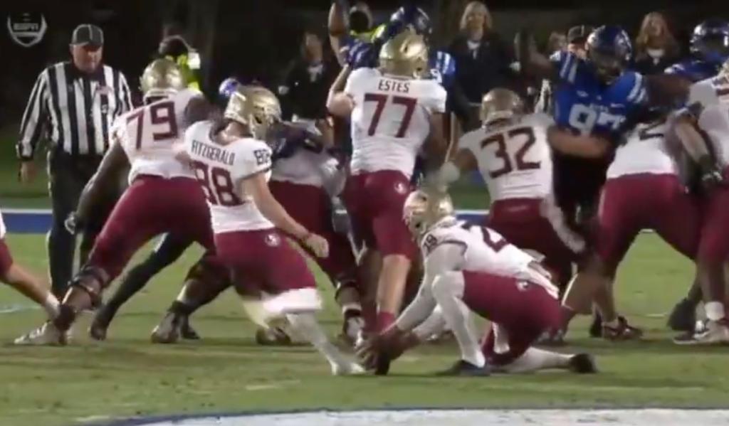 Florida State holder Alex Mastromanno couldn't move his hands before Ryan Fitzgerald came in for the kick.