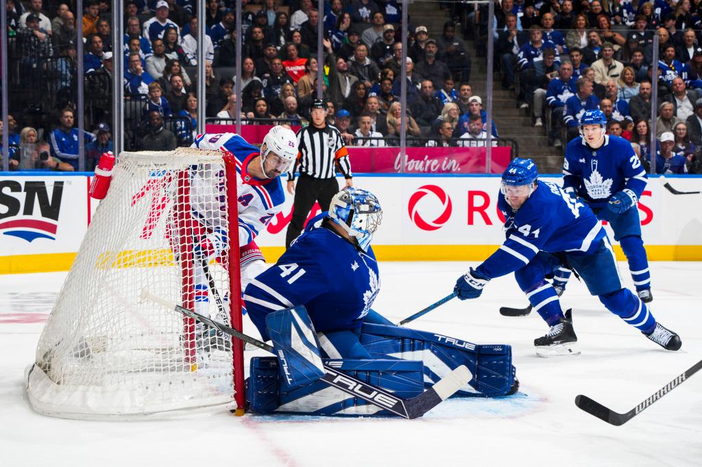 Chris Kreider (left) scores on Anthony Stolarz for the first of his two goals in the Rangers' 4-1 win over the Maple Leafs on Oct. 19, 2024.