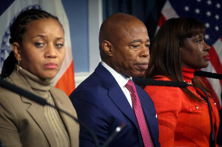 Mayor Eric Adams sits between First Deputy Mayor Sheena Wright, and Chief Advisor Ingrid lewis-Martin, during a press conference amid an election fundraising controversy at City Hall in Manhattan in New York City, U.S., November 14, 2023.