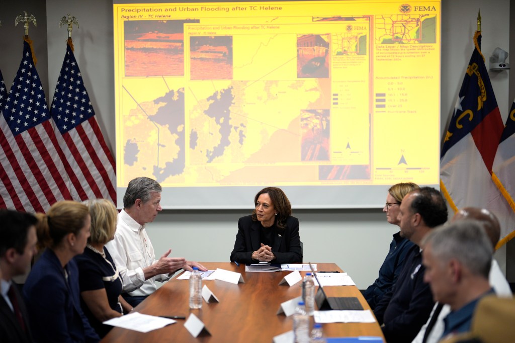 Democratic presidential nominee Vice President Kamala Harris, center right, receives a briefing from North Carolina Gov. Roy Cooper, center left, on the damage from Hurricane Helene, Saturday, October 5, 2024 in Charlotte, N.C. 