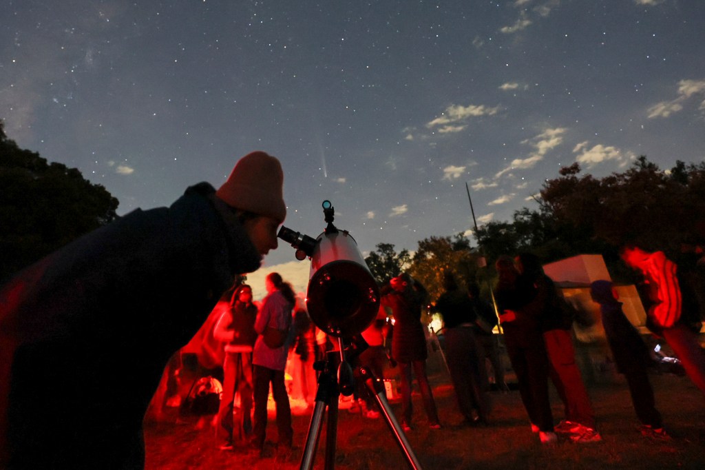 A special so called "Halloween comet," Comet C/2024 S1, is on its way by Earth this week. Seen are stargazers searching for recent Comet C/2023 A3 Tsuchinshan.