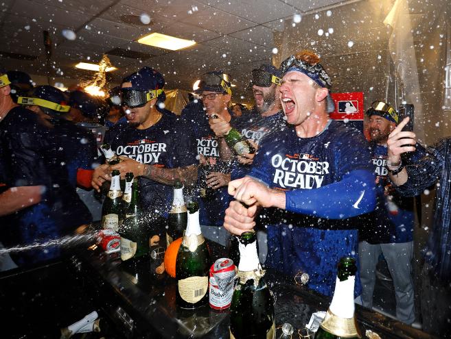 Wild Card game 3: Pete Alonso #20 of the New York Mets celebrates with his teammates in the clubhouse after they win the game. The New York Mets defeat the Milwaukee Brewers 4-2 and advance to the NLDS.