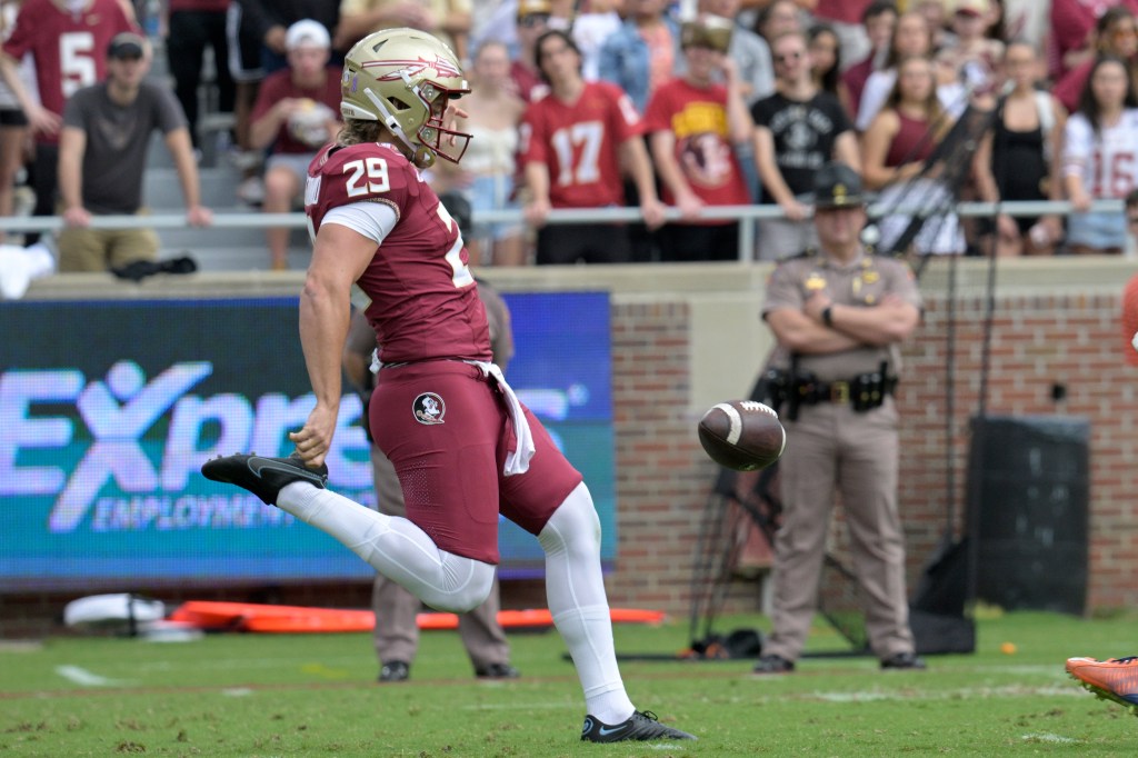 Florida State's Alex Mastromanno (29) kicks the ball away during the first half against Syracuse, Saturday, Oct. 14, 2023. 